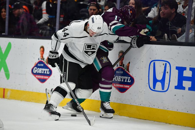 Nov 24, 2023; Anaheim, California, USA; Los Angeles Kings defenseman Mikey Anderson (44) plays for the puck against Anaheim Ducks left wing Alex Killorn (17) during the second period at Honda Center. Mandatory Credit: Gary A. Vasquez-USA TODAY Sports