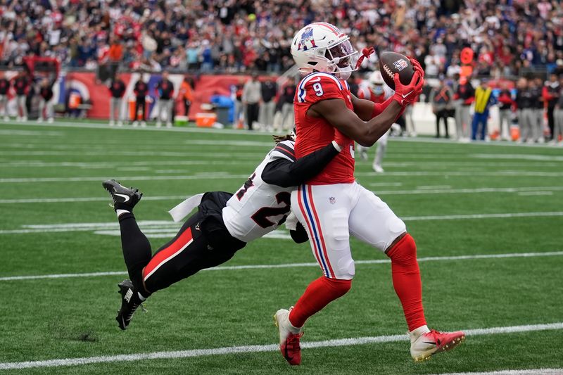 New England Patriots wide receiver Kayshon Boutte (9) scores against Houston Texans cornerback Derek Stingley Jr., left, during the first half of an NFL football game, Sunday, Oct. 13, 2024, in Foxborough, Mass. (AP Photo/Charles Krupa)