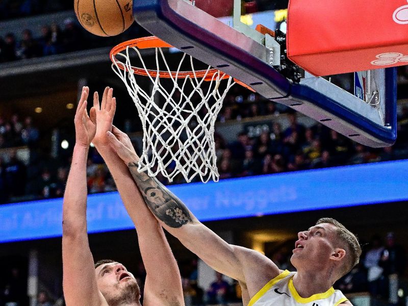 DENVER, COLORADO - MARCH 9: Luka Samanic #19 of the Utah Jazz defends against Nikola Jokic #15 of the Denver Nuggets in the first half of a game at Ball Arena on March 9, 2024 in Denver, Colorado. (Photo by Dustin Bradford/Getty Images)