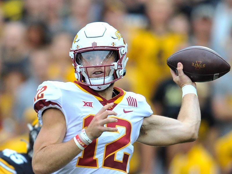 Sep 10, 2022; Iowa City, Iowa, USA; Iowa State Cyclones quarterback Hunter Dekkers (12) throws a pass against the Iowa Hawkeyes during the first quarter at Kinnick Stadium. Mandatory Credit: Jeffrey Becker-USA TODAY Sports