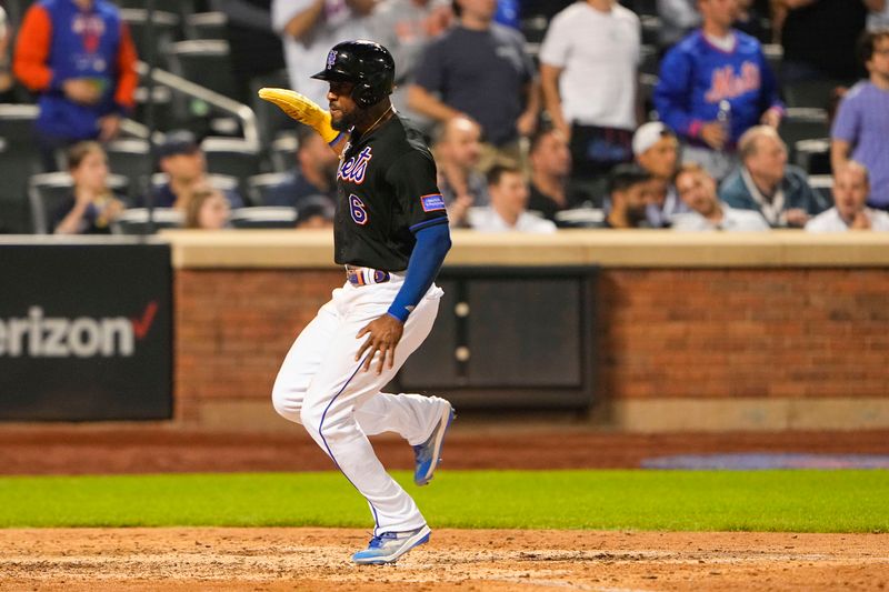 May 21, 2023; New York City, New York, USA; New York Mets right fielder Starling Marte (6) scores a run on a sacrifice fly ball by New York Mets second baseman Jeff McNeil (1) (not pictured) against the Cleveland Guardians during the eighth inning at Citi Field. Mandatory Credit: Gregory Fisher-USA TODAY Sports