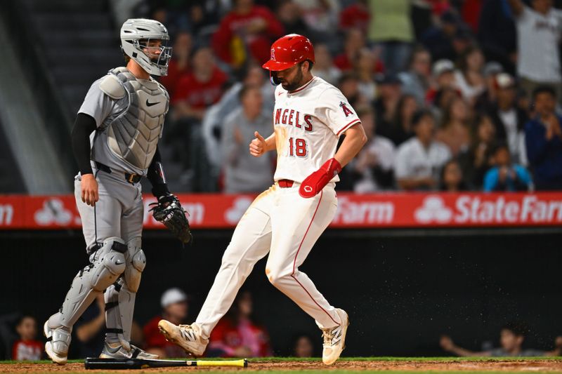 May 3, 2025; Anaheim, California, USA; Los Angeles Angels first baseman Nolan Schanuel (18) scores against Detroit Tigers catcher Dillon Dingler (13) during the sixth inning at Angel Stadium. Mandatory Credit: Jonathan Hui-Imagn Images