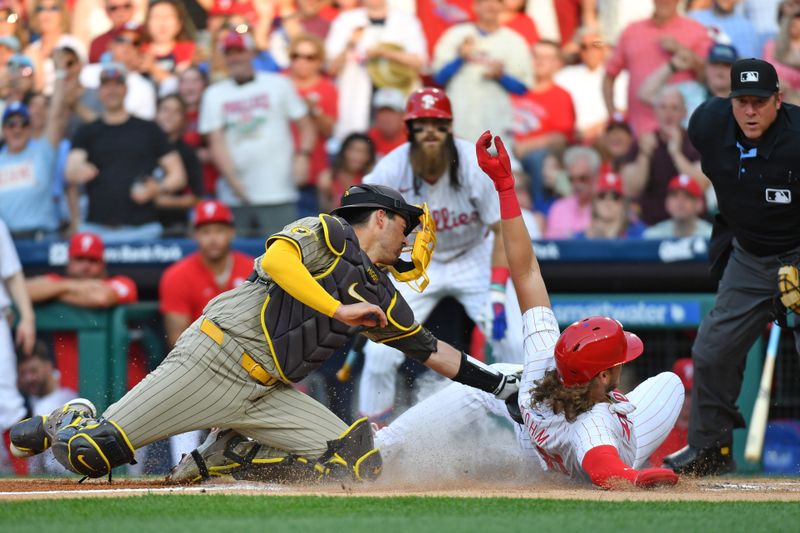 Jun 17, 2024; Philadelphia, Pennsylvania, USA; San Diego Padres catcher Kyle Higashioka (20) tags out Philadelphia Phillies third base Alec Bohm (28) at home during the second inning at Citizens Bank Park. Mandatory Credit: Eric Hartline-USA TODAY Sports