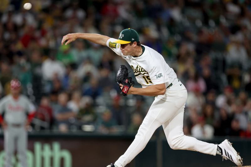 May 23, 2025; West Sacramento, California, USA; Athletics pitcher Mason Miller (19) throws a pitch against the Philadelphia Phillies during the ninth inning at Sutter Health Park. Mandatory Credit: Dennis Lee-Imagn Images