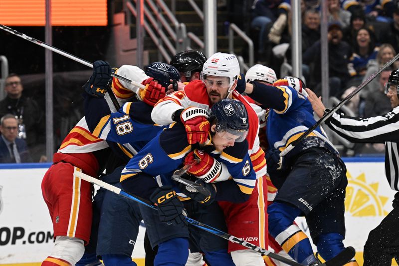 Jan 16, 2025; St. Louis, Missouri, USA; The Calgary Flames get physical with the St. Louis Blues in the second period at Enterprise Center. Mandatory Credit: Joe Puetz-Imagn Images