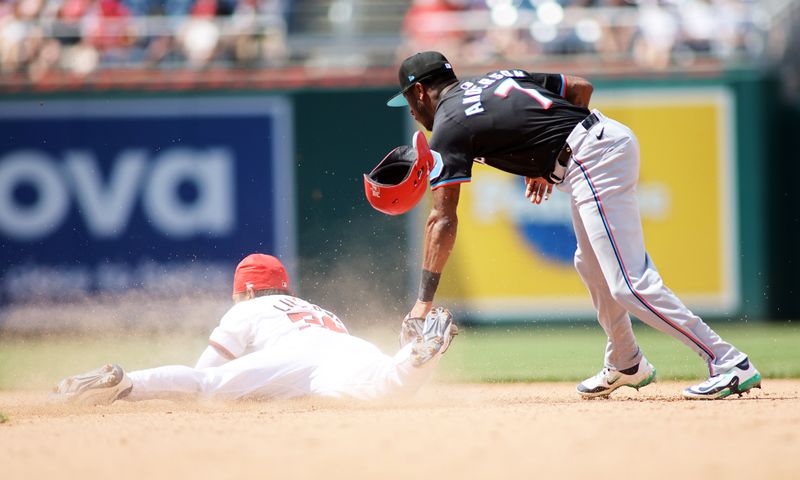 Jun 16, 2024; Washington, District of Columbia, USA; Miami Marlins shortstop Tim Anderson (7) tags out Washington Nationals third base Trey Lipscomb (38) during the seventh inning in a game at Nationals Park. Mandatory Credit: Daniel Kucin Jr.-USA TODAY Sports