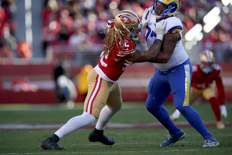 San Francisco 49ers defensive end Chase Young (92) fights through Los Angeles Rams offensive tackle Alaric Jackson (77) during an NFL football game, Monday, Jan. 7, 2024, in Santa Clara, Calif. (AP Photo/Scot Tucker)