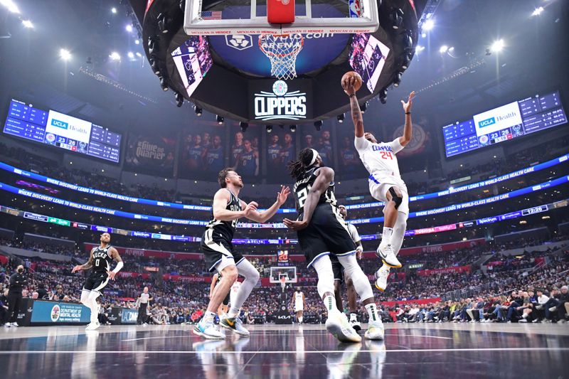 LOS ANGELES, CA - MARCH 10: Norman Powell #24 of the LA Clippers shoots the ball during the game against the Milwaukee Bucks on March 10, 2024 at Crypto.Com Arena in Los Angeles, California. NOTE TO USER: User expressly acknowledges and agrees that, by downloading and/or using this Photograph, user is consenting to the terms and conditions of the Getty Images License Agreement. Mandatory Copyright Notice: Copyright 2024 NBAE (Photo by Adam Pantozzi/NBAE via Getty Images)