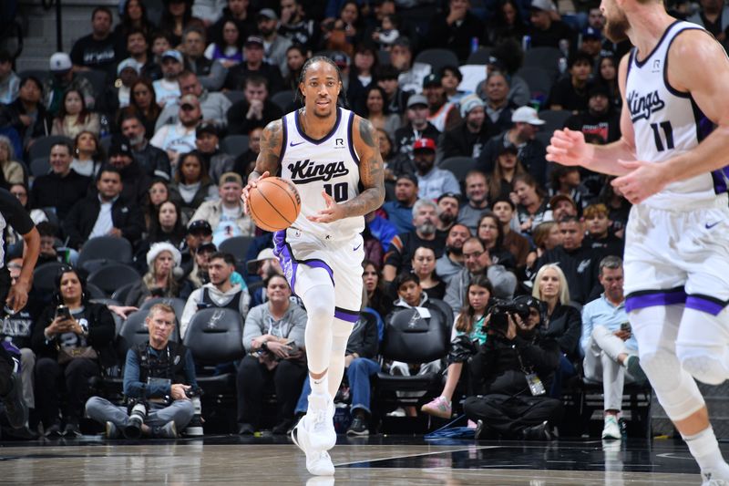 SAN ANTONIO, TX - DECEMBER 6:  DeMar DeRozan #10 of the Sacramento Kings handles the ball during the game against the San Antonio Spurs on December 6, 2024 at the Frost Bank Center in San Antonio, Texas. NOTE TO USER: User expressly acknowledges and agrees that, by downloading and or using this photograph, user is consenting to the terms and conditions of the Getty Images License Agreement. Mandatory Copyright Notice: Copyright 2024 NBAE (Photos by Michael Gonzales/NBAE via Getty Images)