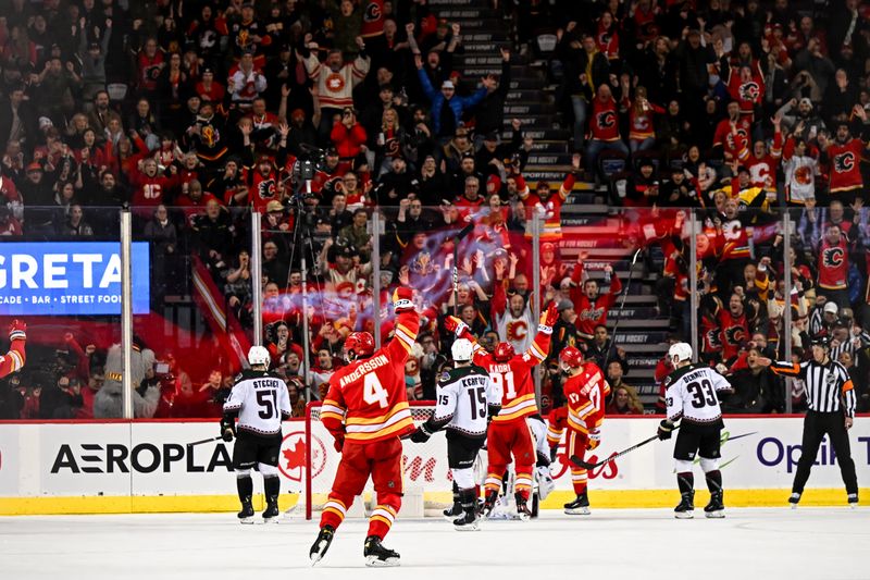 Jan 16, 2024; Calgary, Alberta, CAN; Calgary Flames center Yegor Sharangovich (17) and teammates celebrate after scoring in overtime against the Arizona Coyotes at Scotiabank Saddledome. Mandatory Credit: Brett Holmes-USA TODAY Sports