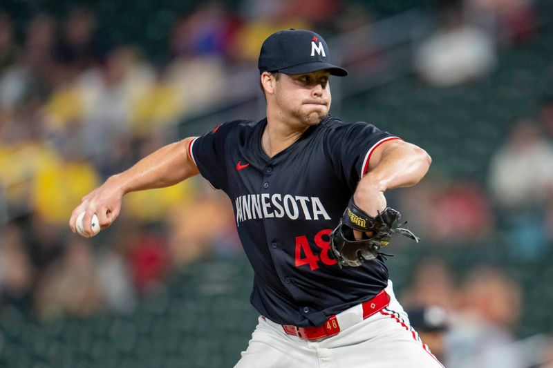 Sep 25, 2024; Minneapolis, Minnesota, USA; Minnesota Twins pitcher Justin Topa (48) delivers a pitch against the Miami Marlins in the ninth inning at Target Field. Mandatory Credit: Jesse Johnson-Imagn Images