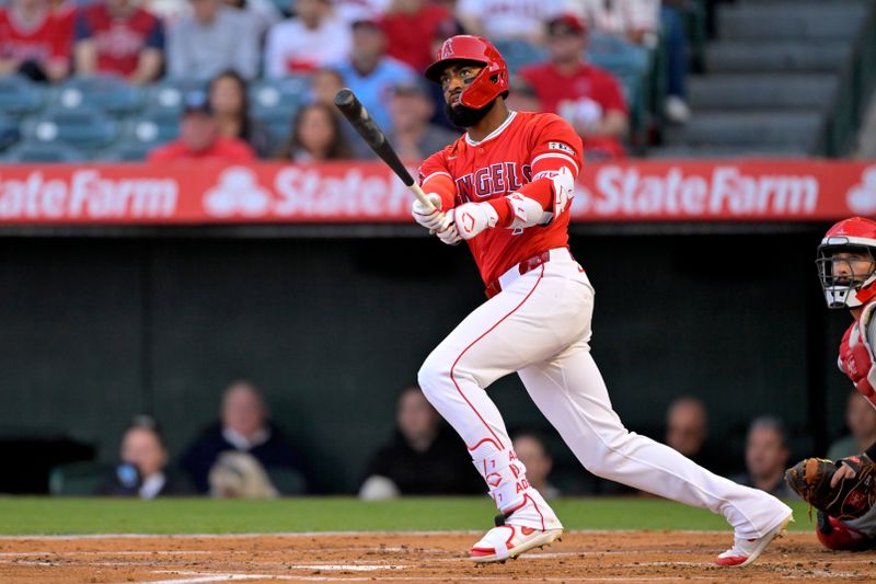 Apr 29, 2024; Anaheim, California, USA; Los Angeles Angels outfielder Jo Adell (7) watches the flight of the ball on a solo home run in the first inning against the Philadelphia Phillies at Angel Stadium. Mandatory Credit: Jayne Kamin-Oncea-USA TODAY Sports