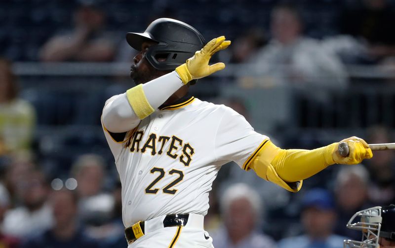 Apr 8, 2024; Pittsburgh, Pennsylvania, USA;  Pittsburgh Pirates designated hitter Andrew McCutchen (22) hits a double against the Detroit Tigers during the sixth inning at PNC Park. Mandatory Credit: Charles LeClaire-USA TODAY Sports