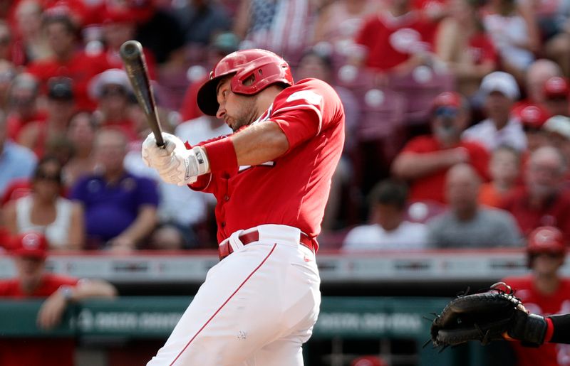 Aug 5, 2023; Cincinnati, Ohio, USA; Cincinnati Reds catcher Luke Maile (22) hits a single against the Washington Nationals during the sixth inning at Great American Ball Park. Mandatory Credit: David Kohl-USA TODAY Sports