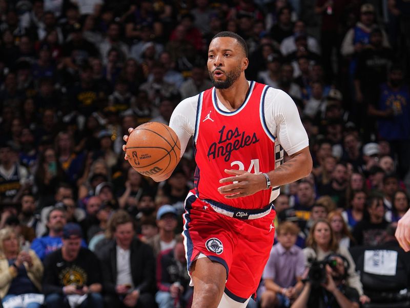 DENVER, CO - APRIL 21: Norman Powell #24 of the LA Clippers dribbles the ball during Round One Game One of the 2025 NBA Playoffs Denver Nuggets on April 21, 2025 at Ball Arena in Denver, Colorado. NOTE TO USER: User expressly acknowledges and agrees that, by downloading and/or using this Photograph, user is consenting to the terms and conditions of the Getty Images License Agreement. Mandatory Copyright Notice: Copyright 2025 NBAE (Photo by Bart Young/NBAE via Getty Images)