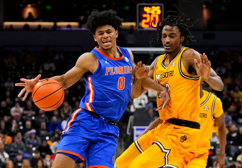 Jan 20, 2024; Columbia, Missouri, USA; Florida Gators guard Zyon Pullin (0) drives against Missouri Tigers forward Aidan Shaw (23) during the second half at Mizzou Arena. Mandatory Credit: Jay Biggerstaff-USA TODAY Sports