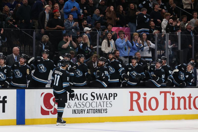 Jan 13, 2026; Salt Lake City, Utah, USA; The Utah Mammoth celebrate a goal by right wing Dylan Guenther (11) during the second period against the Toronto Maple Leafs at Delta Center. Mandatory Credit: Rob Gray-Imagn Images