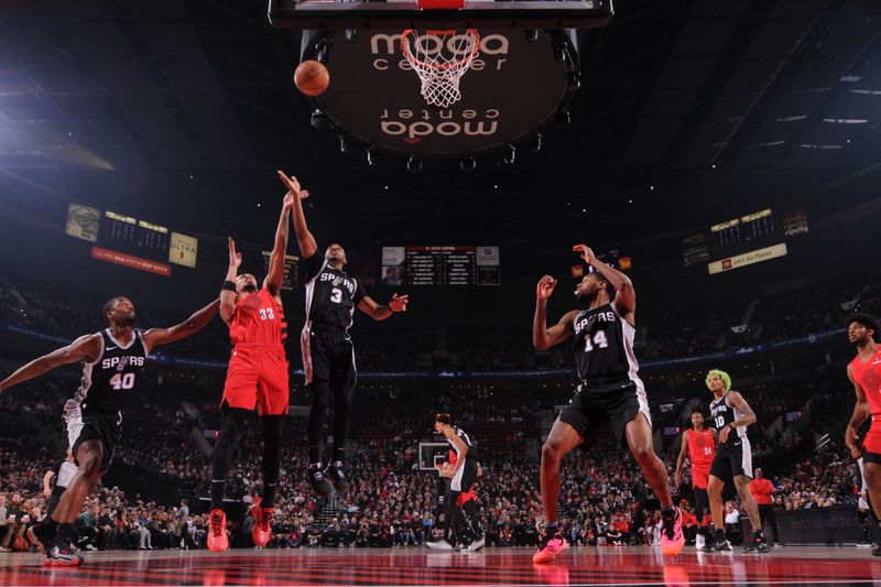 PORTLAND, OR - DECEMBER 13: Chris Paul #3 of the San Antonio Spurs goes up for the rebound during the game against the Portland Trail Blazers on December 13, 2024 at the Moda Center Arena in Portland, Oregon. NOTE TO USER: User expressly acknowledges and agrees that, by downloading and or using this photograph, user is consenting to the terms and conditions of the Getty Images License Agreement. Mandatory Copyright Notice: Copyright 2024 NBAE (Photo by Cameron Browne/NBAE via Getty Images)