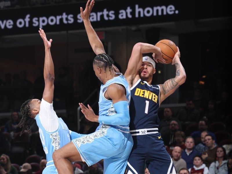 CLEVELAND, OH - DECEMBER 5: Michael Porter Jr. #1 of the Denver Nuggets passes the ball during the game against the Cleveland Cavaliers on December 5, 2024 at Rocket Mortgage FieldHouse in Cleveland, Ohio. NOTE TO USER: User expressly acknowledges and agrees that, by downloading and or using this photograph, User is consenting to the terms and conditions of the Getty Images License Agreement. Mandatory Copyright Notice: Copyright 2024 NBAE (Photo by Jeff Haynes/NBAE via Getty Images)