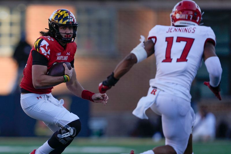 Nov 26, 2022; College Park, Maryland, USA; Maryland Terrapins quarterback Eric Najarian (22) carries the ball while Rutgers Scarlet Knights linebacker Deion Jennings (17) runs to tackle him during the fourth quarter at SECU Stadium. Mandatory Credit: Brent Skeen-USA TODAY Sports