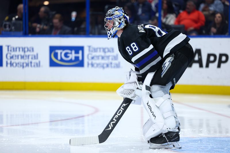 Nov 16, 2024; Tampa, Florida, USA; Tampa Bay Lightning goaltender Andrei Vasilevskiy (88) looks on before the second period against the  New Jersey Devils at Amalie Arena. Mandatory Credit: Nathan Ray Seebeck-Imagn Images