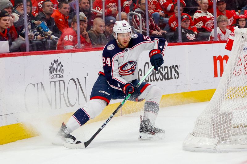 Mar 19, 2024; Detroit, Michigan, USA; Columbus Blue Jackets right wing Mathieu Olivier (24) handles the puck during the first period of the game against the Detroit Red Wings at Little Caesars Arena. Mandatory Credit: Brian Bradshaw Sevald-USA TODAY Sports