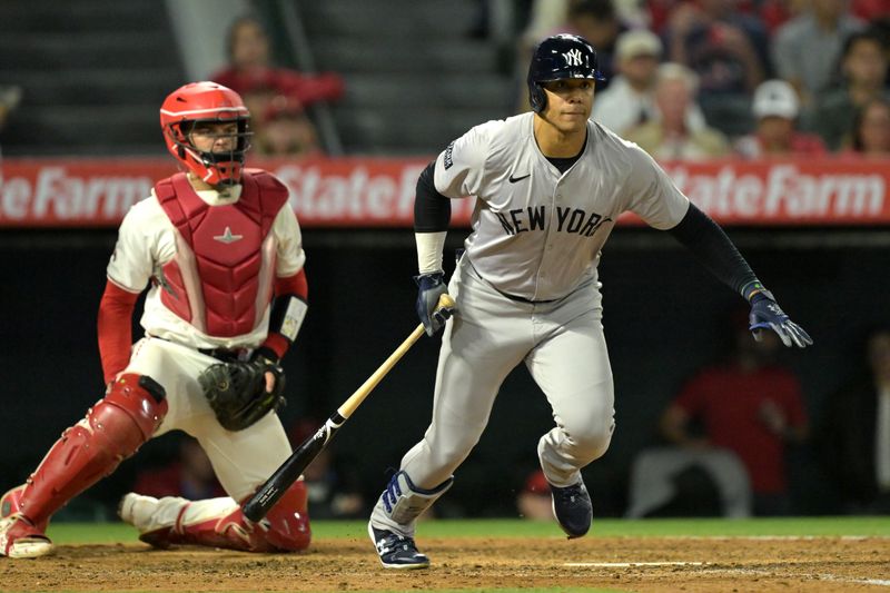 May 30, 2024; Anaheim, California, USA;  New York Yankees right fielder Juan Soto (22) triples in three runs in the seventh inning against the Los Angeles Angels at Angel Stadium. Mandatory Credit: Jayne Kamin-Oncea-USA TODAY Sports