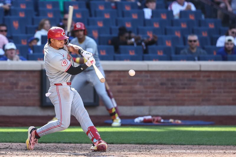 Sep 8, 2024; New York City, New York, USA;  Cincinnati Reds designated hitter Santiago Espinal (4) his a two run double in the ninth inning against the New York Mets at Citi Field. Mandatory Credit: Wendell Cruz-Imagn Images