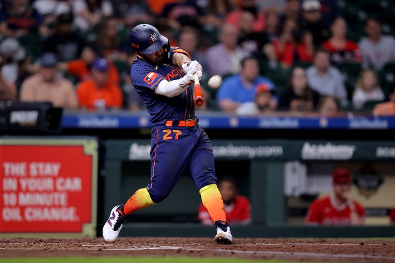 May 20, 2024; Houston, Texas, USA; Houston Astros second baseman Jose Altuve (27) hits a three-run home run to left field against the Los Angeles Angels during the second inning at Minute Maid Park. Mandatory Credit: Erik Williams-USA TODAY Sports