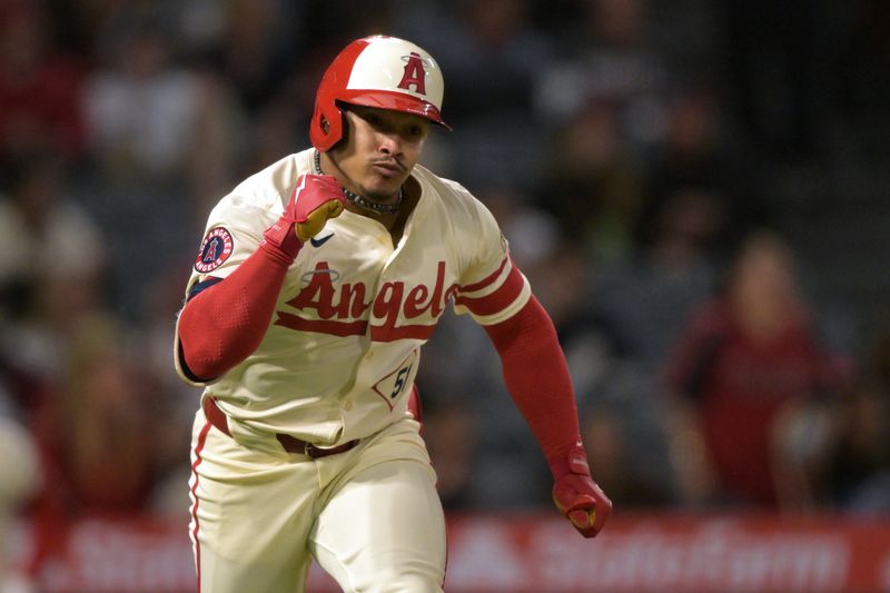 Sep 16, 2024; Anaheim, California, USA;  Los Angeles Angels right fielder Gustavo Campero (51) pumps his fist as he runs to first on a RBI single in the seventh inning  against the Chicago White Sox at Angel Stadium. Mandatory Credit: Jayne Kamin-Oncea-Imagn Images