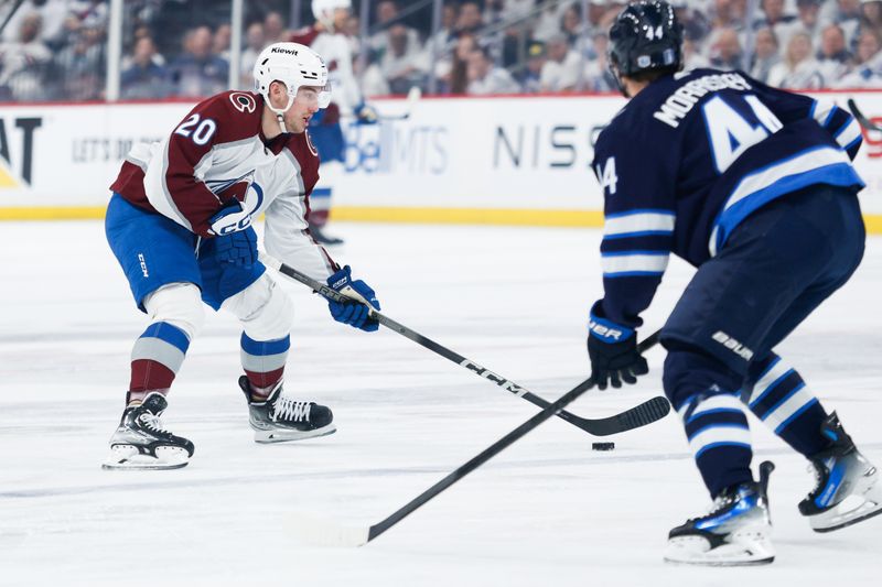 Apr 23, 2024; Winnipeg, Manitoba, CAN; Colorado Avalanche forward Ross Colton (20) skates in on Winnipeg Jets defenseman Josh Morrissey (44) during the first period in game two of the first round of the 2024 Stanley Cup Playoffs at Canada Life Centre. Mandatory Credit: Terrence Lee-USA TODAY Sports