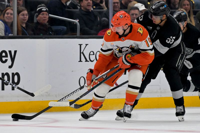 Dec 27, 2025; Los Angeles, California, USA;  Anaheim Ducks left wing Chris Kreider (20) and Los Angeles Kings right wing Quinton Byfield (55) vie for the puck during the second period at Crypto.com Arena. Mandatory Credit: Jayne Kamin-Oncea-Imagn Images