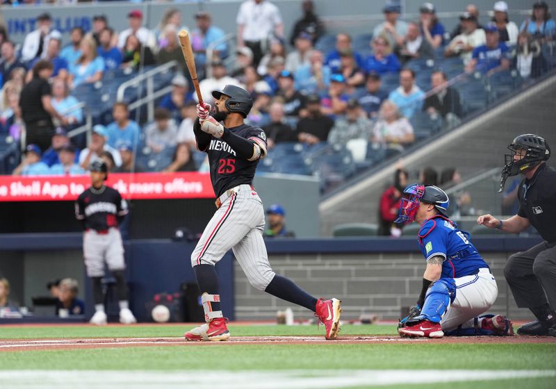 Aug 27, 2025; Toronto, Ontario, CAN; Minnesota Twins centre fielder Byron Buxton (25) hits a home run against the Toronto Blue Jays during the first inning at Rogers Centre. Mandatory Credit: Nick Turchiaro-Imagn Images
