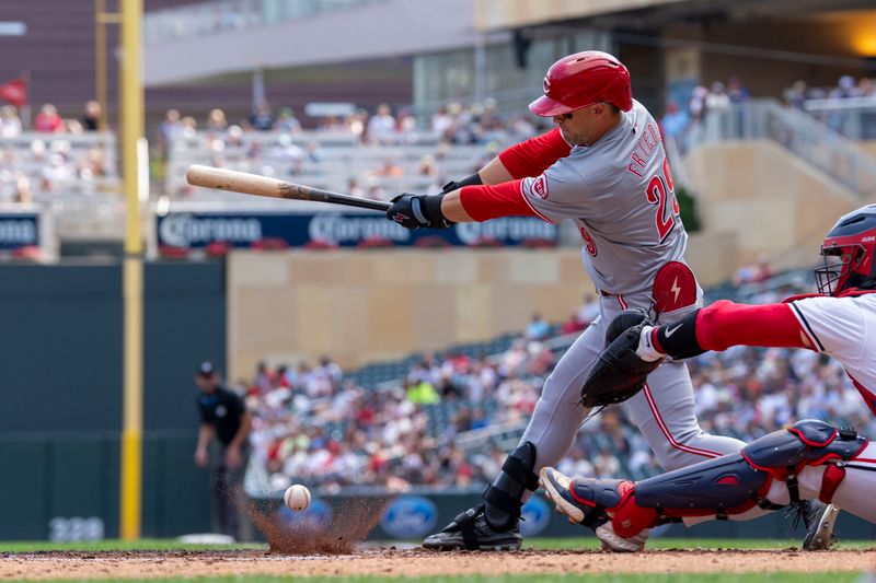 Sep 15, 2024; Minneapolis, Minnesota, USA; Cincinnati Reds center fielder TJ Friedl (29) hits a infield single against the Minnesota Twins in the fourth inning at Target Field. Mandatory Credit: Jesse Johnson-Imagn Images