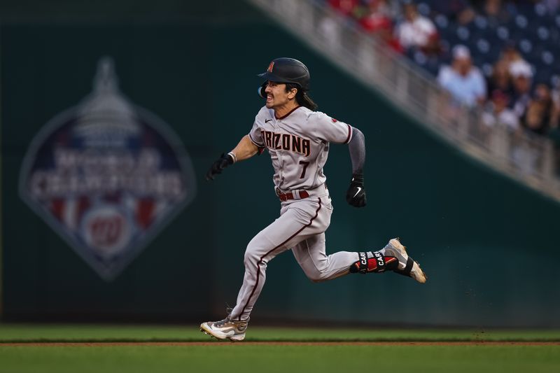 Jun 7, 2023; Washington, District of Columbia, USA; Arizona Diamondbacks left fielder Corbin Carroll (7) singles and attempts to advance to second base during the fifth inning against the Washington Nationals at Nationals Park. Mandatory Credit: Scott Taetsch-USA TODAY Sports