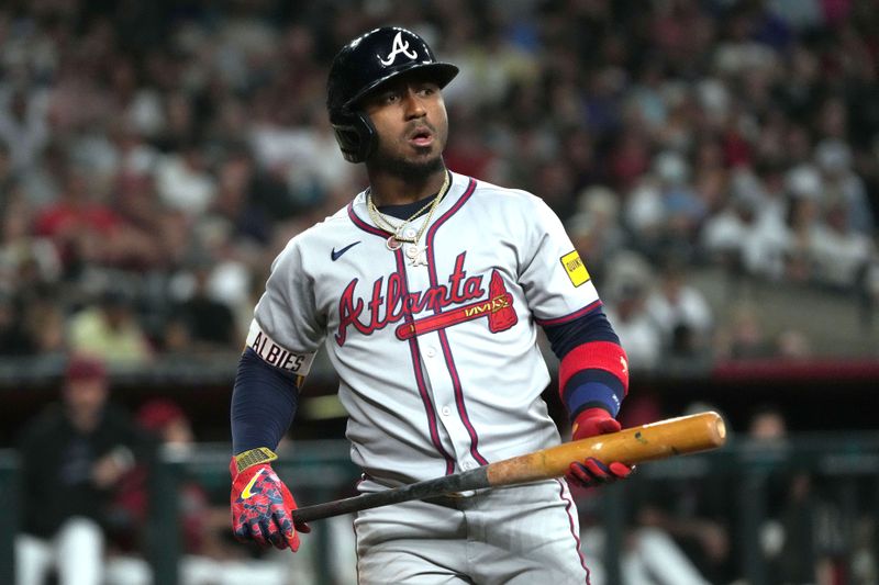 Apr 25, 2025; Phoenix, Arizona, USA; Atlanta Braves second base Ozzie Albies (1) reacts after missing a pitch against the Atlanta Braves in the first inning at Chase Field. Mandatory Credit: Rick Scuteri-Imagn Images