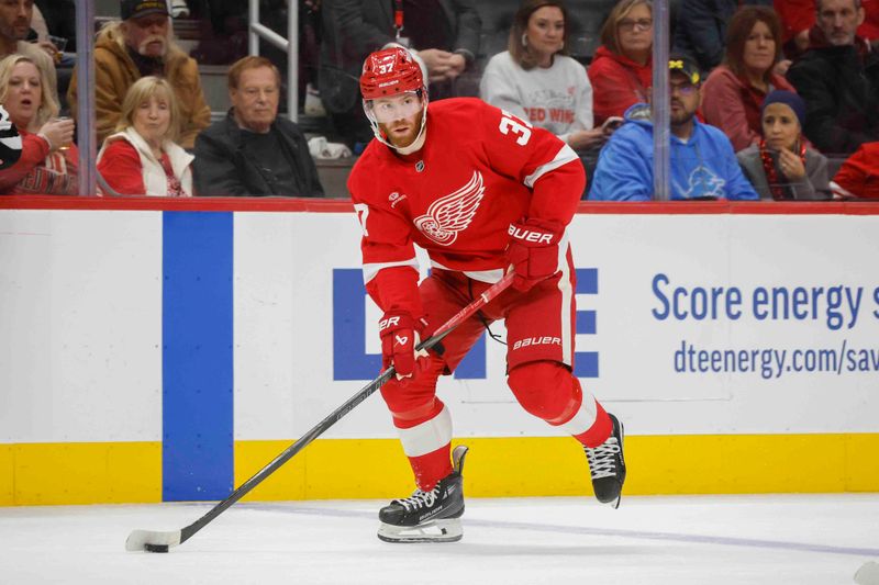 Nov 23, 2024; Detroit, Michigan, USA; Detroit Red Wings left wing J.T. Compher (37) handles the puck during the second period of the game against the Boston Bruins at Little Caesars Arena. Mandatory Credit: Brian Bradshaw Sevald-Imagn Images