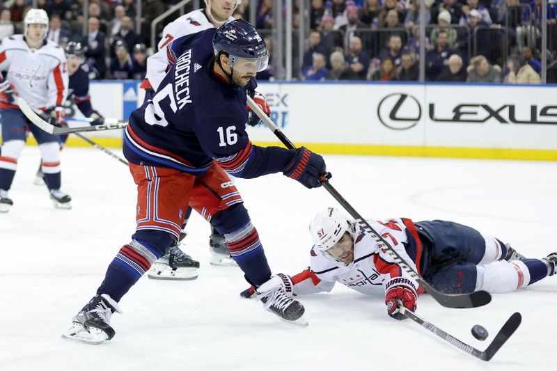 Jan 14, 2024; New York, New York, USA; New York Rangers center Vincent Trocheck (16) takes a shot against Washington Capitals defenseman Trevor van Riemsdyk (57) during the second period at Madison Square Garden. Mandatory Credit: Brad Penner-USA TODAY Sports