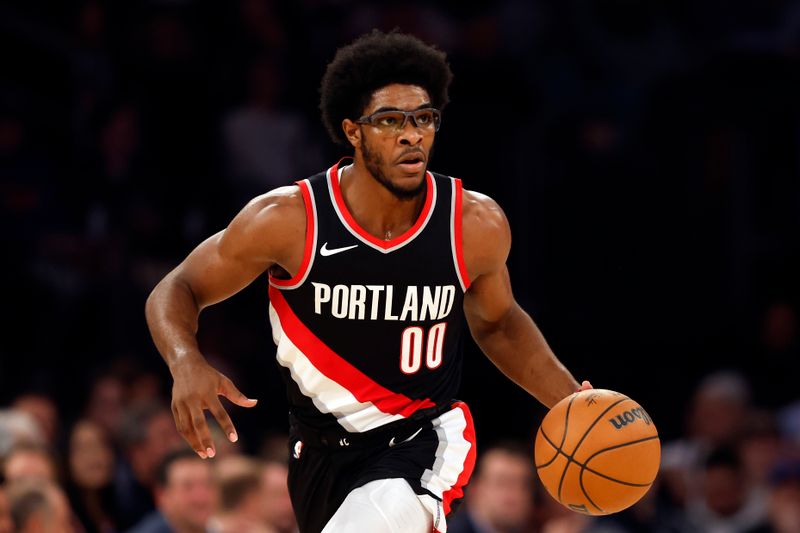 NEW YORK, NEW YORK - JANUARY 09: Scoot Henderson #00 of the Portland Trail Blazers dribbles during the first half against the New York Knicks at Madison Square Garden on January 09, 2024 in New York City. NOTE TO USER: User expressly acknowledges and agrees that, by downloading and/or using this Photograph, user is consenting to the terms and conditions of the Getty Images License Agreement. (Photo by Sarah Stier/Getty Images)