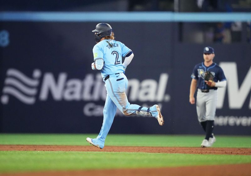 Jul 23, 2024; Toronto, Ontario, CAN; Toronto Blue Jays designated hitter Justin Turner (2) runs the bases after hitting a home run against the Tampa Bay Rays during the sixth inning at Rogers Centre. Mandatory Credit: Nick Turchiaro-USA TODAY Sports