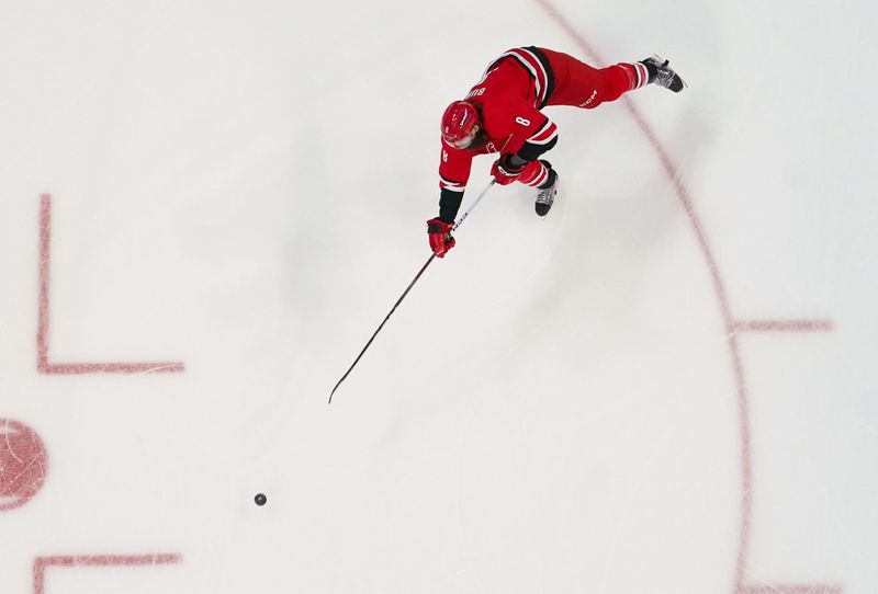 Dec 23, 2023; Raleigh, North Carolina, USA; Carolina Hurricanes defenseman Brent Burns (8) makes a pass against the New York Islanders during the first period at PNC Arena. Mandatory Credit: James Guillory-USA TODAY Sports