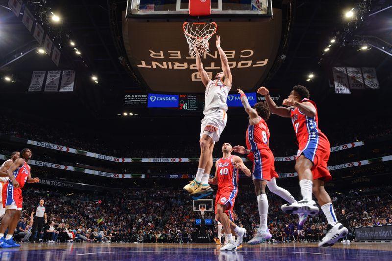 PHOENIX, AZ - MARCH 20:  Devin Booker #1 of the Phoenix Suns drives to the basket during the game against the Philadelphia 76ers on March 20, 2024 at Footprint Center in Phoenix, Arizona. NOTE TO USER: User expressly acknowledges and agrees that, by downloading and or using this photograph, user is consenting to the terms and conditions of the Getty Images License Agreement. Mandatory Copyright Notice: Copyright 2024 NBAE (Photo by Barry Gossage/NBAE via Getty Images)