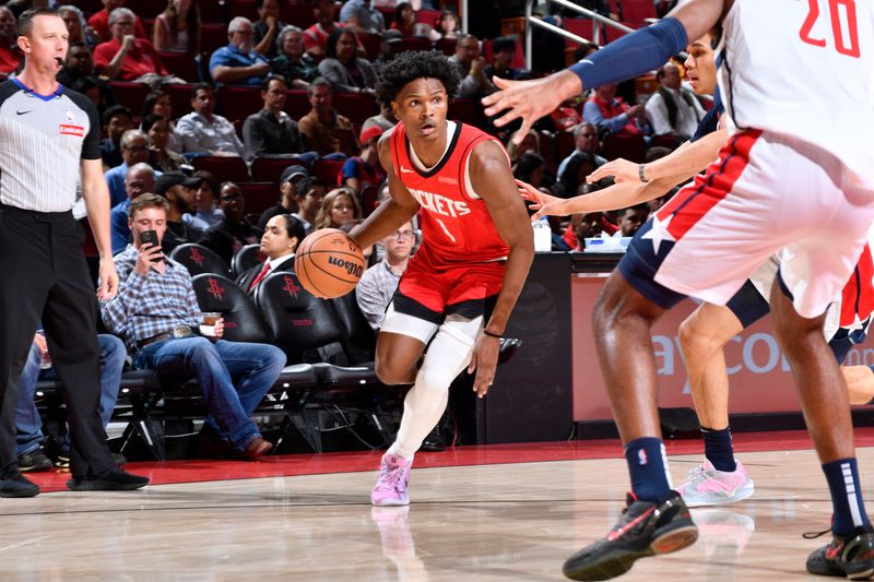 HOUSTON, TX - NOVEMBER 11: Amen Thompson #1 of the Houston Rockets dribbles the ball during the game against the Washington Wizards on November 11, 2024 at the Toyota Center in Houston, Texas. NOTE TO USER: User expressly acknowledges and agrees that, by downloading and or using this photograph, User is consenting to the terms and conditions of the Getty Images License Agreement. Mandatory Copyright Notice: Copyright 2024 NBAE (Photo by Logan Riely/NBAE via Getty Images)