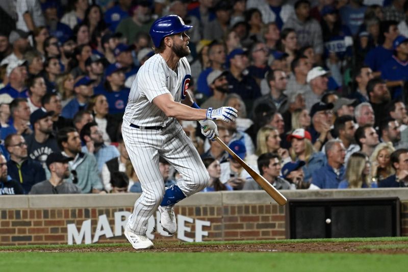 Sep 20, 2023; Chicago, Illinois, USA; Chicago Cubs third baseman Patrick Wisdom (16) hits an RBI during the sixth inning against the Pittsburgh Pirates at Wrigley Field. Mandatory Credit: Matt Marton-USA TODAY Sports