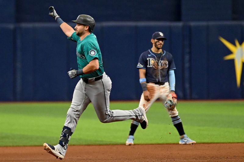 Jun 26, 2024; St. Petersburg, Florida, USA; Seattle Mariners designated hitter Cal Raleigh (29) celebrates after hitting a three run home run against the Tampa Bay Rays in the sixth inning at Tropicana Field. Mandatory Credit: Jonathan Dyer-USA TODAY Sports