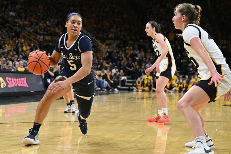 Feb 8, 2024; Iowa City, Iowa, USA; Penn State Nittany Lions guard Leilani Kapinus (5) controls the ball as Iowa Hawkeyes guard Kate Martin (20) defends during the first half at Carver-Hawkeye Arena. Mandatory Credit: Jeffrey Becker-USA TODAY Sports