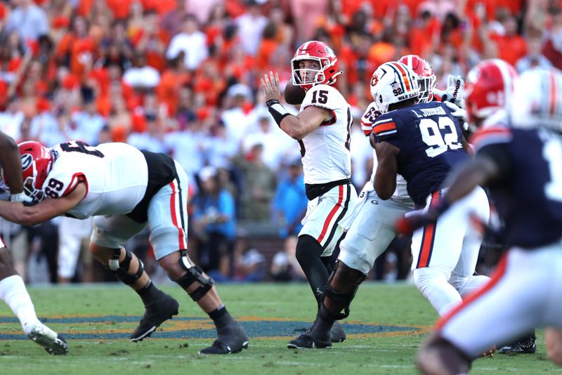 Sep 30, 2023; Auburn, Alabama, USA;  Georgia Bulldogs quarterback Carson Beck (15) looks for a receiver during the fourth quarter against the Auburn Tigers at Jordan-Hare Stadium. Mandatory Credit: John Reed-USA TODAY Sports