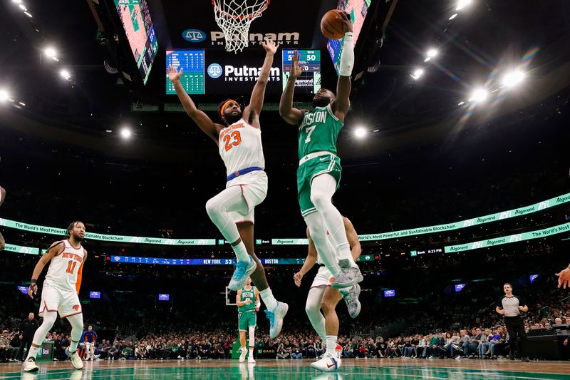 BOSTON, MA - DECEMBER 8: Jaylen Brown #7 of the Boston Celtics goes to the basket against Mitchell Robinson #23 of the New York Knicks during the second quarter at TD Garden on December 8, 2023 in Boston, Massachusetts. NOTE TO USER: User expressly acknowledges and agrees that, by downloading and/or using this Photograph, user is consenting to the terms and conditions of the Getty Images License Agreement. (Photo By Winslow Townson/Getty Images)