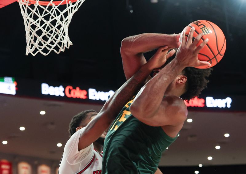 Feb 10, 2025; Houston, Texas, USA;  Baylor Bears forward Norchad Omier (15) shoots against Houston Cougars forward Ja'Vier Francis (5) in the second half at Fertitta Center. Mandatory Credit: Thomas Shea-Imagn Images