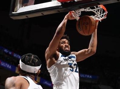 MINNEAPOLIS, MN - NOVEMBER 30: Karl-Anthony Towns #32 of the Minnesota Timberwolves dunks the ball during the game against the Utah Jazz on November 30, 2023 at Target Center in Minneapolis, Minnesota. NOTE TO USER: User expressly acknowledges and agrees that, by downloading and or using this Photograph, user is consenting to the terms and conditions of the Getty Images License Agreement. Mandatory Copyright Notice: Copyright 2023 NBAE (Photo by David Sherman/NBAE via Getty Images)